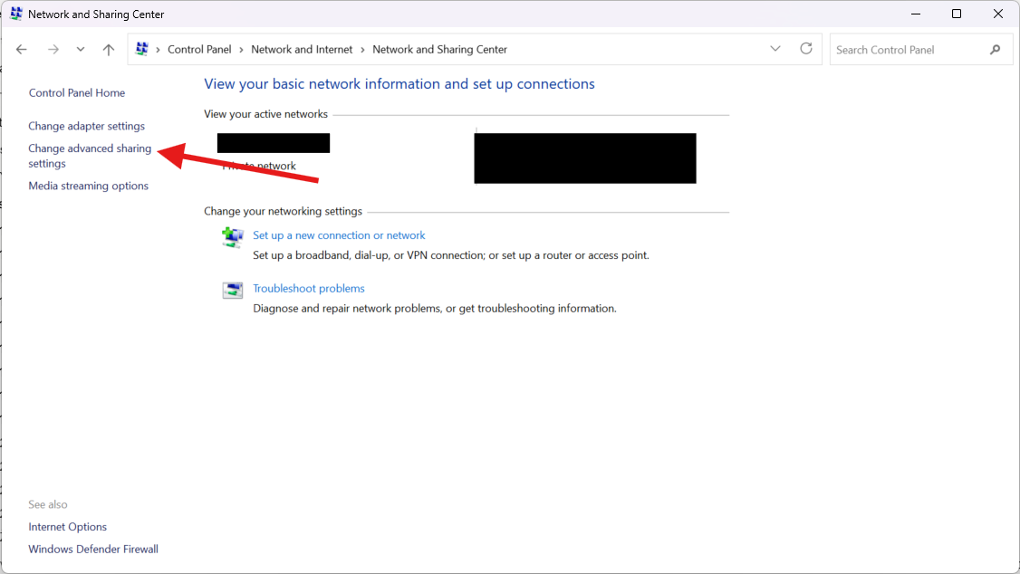 Centrum sietí a zdieľania s vyznačeným odkazom Change advanced sharing settings v ľavom paneli